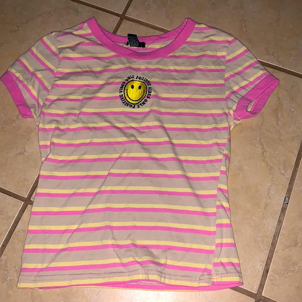 I am selling a tee shirt from rue21 the colors ok it are pink,yellow, and cream.